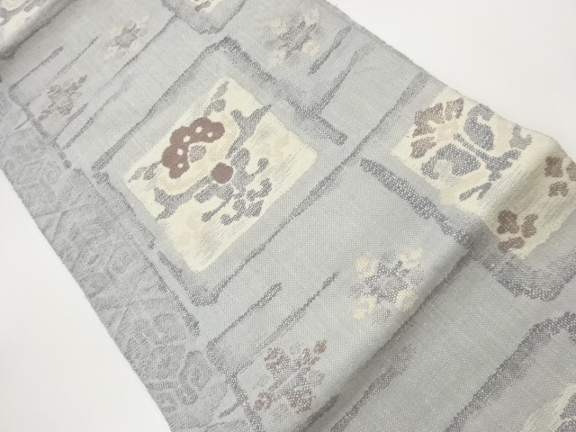 手織り真綿紬色紙に抽象花葉模様織出し名古屋帯